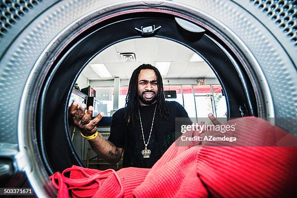 at laundromat - washer stock pictures, royalty-free photos & images