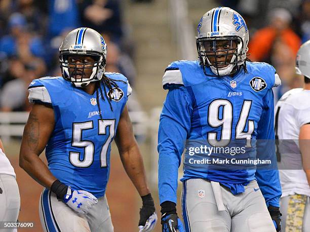 Josh Bynes and Ezekiel Ansah of the Detroit Lions look on from the field during the game against the Oakland Raiders at Ford Field on November 22,...
