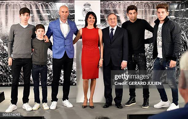 Real Madrid's new French coach Zinedine Zidane poses with his wife Veronique and their sons and Real Madrid's president Florentino Perez after a...