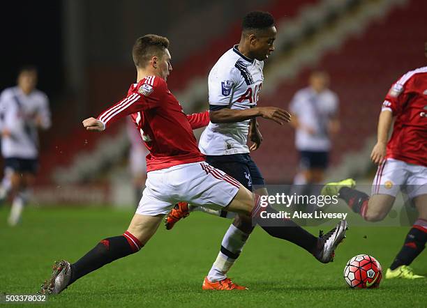 Kyle Walker-Peters of Tottenham Hotspur U21 takes on Guillermo Varela of Manchester United U21 during the Barclays U21 Premier League match between...