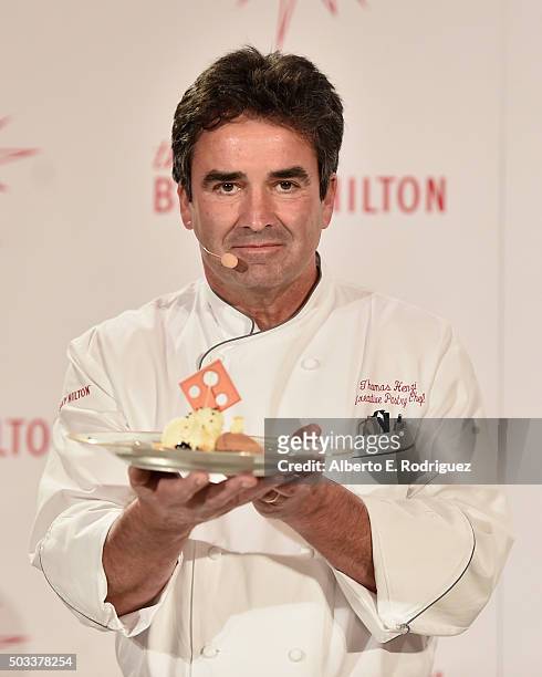 Executive Pastry Chef Thomas Henzi prepares the dessert at the 73rd Golden Globes Menu Preview at The Beverly Hilton Hotel on January 4, 2016 in...