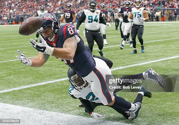 Fiedorowicz of the Houston Texans can't hold onto the ball as he his pushed out of bounds by Aaron Colvin of the Jacksonville Jaguars at NRG Stadium...