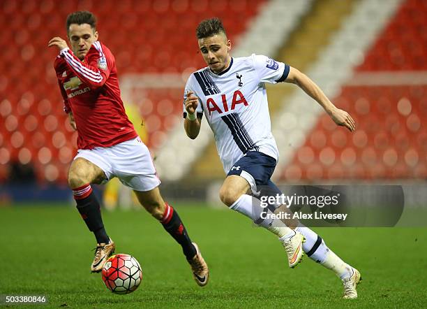 Anthony Georgiou of Tottenham Hotspur U21 takes on Joe Riley of Manchester United U21 during the Barclays U21 Premier League match between Manchester...