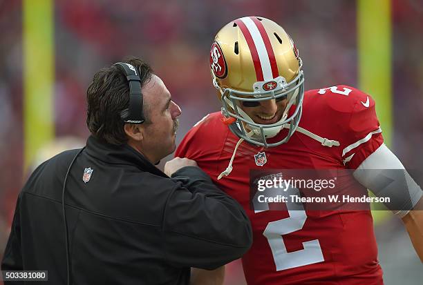 Head coach Jim Tomsula of the San Francisco 49ers talks with his quarterback Blaine Gabbert against the St. Louis Rams during an NFL football game at...