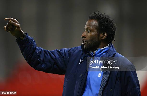 Ugo Ehiogu the manager of Tottenham Hotspur U21 looks on during the Barclays U21 Premier League match between Manchester United U21 and Tottenham...