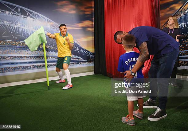 Tim Cahill poses alongside his son Cruz with his wax figure at Madame Tussauds Sydney on January 5, 2016 in Sydney, Australia.