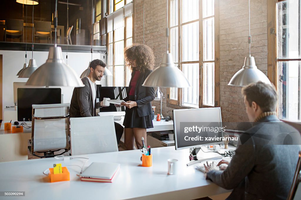 Two creatives talking in the office