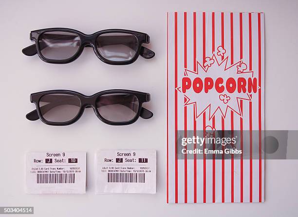 knolling: cinema tickets, 3d glasses and a pop corn bag - neat video stock pictures, royalty-free photos & images