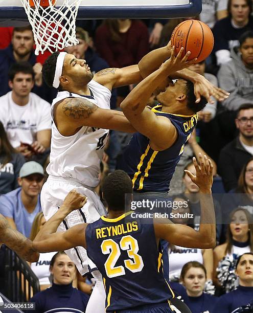 Jermaine Crumpton of the Canisius Golden Griffins is fouled by Chris Brady of the Monmouth Hawks during the second half of a college basketball game...