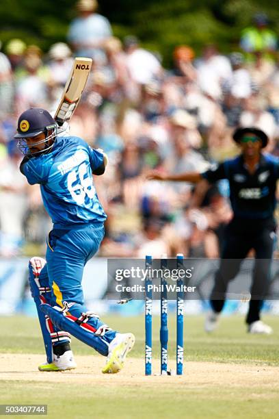 Lahiru Thirimanne of Sri Lanka is bowled by Matt Henry of New Zealand during game five of the One Day International series between New Zealand and...