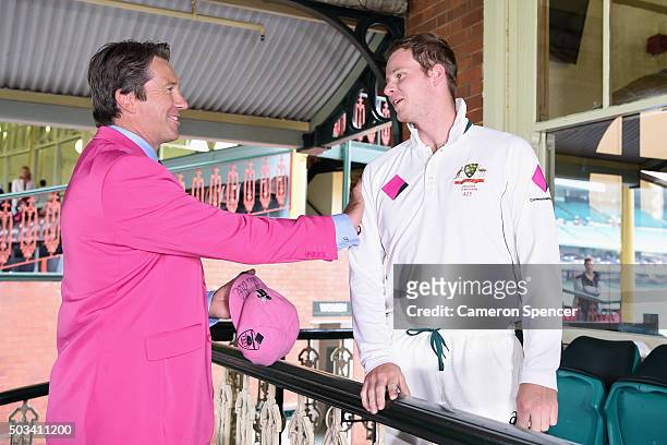 Australian captain Steve Smith presents Former Australian bowler Glenn McGrath with his Pink Cap on Jane McGrath Day during day three of the third...