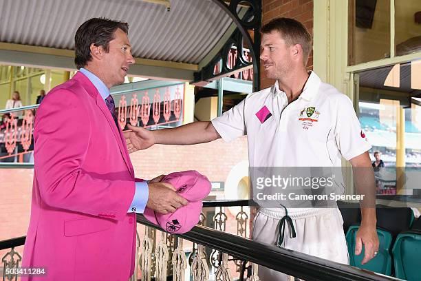 David Warner of Australia presents former Australian bowler Glenn McGrath with his Pink Cap on Jane McGrath Day during day three of the third Test...