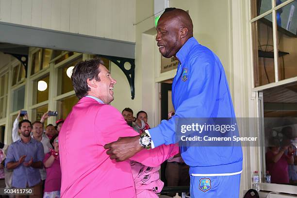 Former Australian bowler Glenn McGrath embraces fomer West Indies bowler and West Indies Bowling Coach Curtley Ambrose on Jane McGrath Day during day...