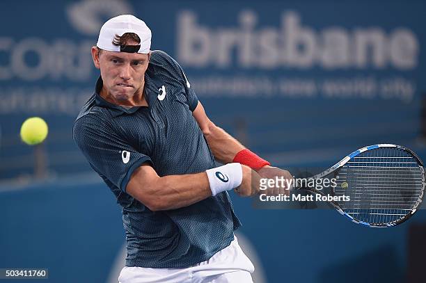 James Duckworth of Australia plays a backhand against Dominic Thiem of Austria during day three of the 2016 Brisbane International at Pat Rafter...