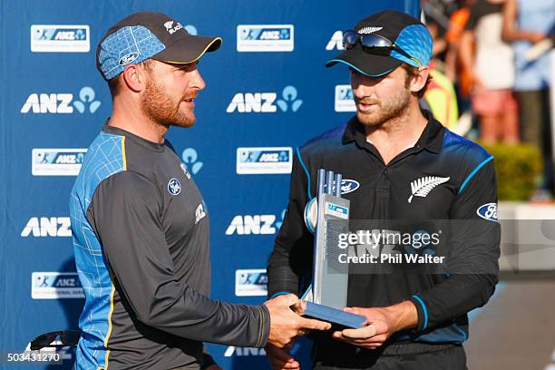 Series captains Brendon McCullum and Kane Williamson receive the winning trophy during game five of the One Day International series between New...