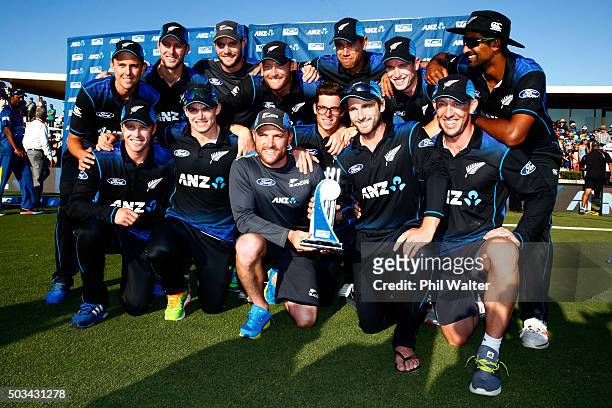 The New Zealand Blackcaps pose with the winning trophy following game five of the One Day International series between New Zealand and Sri Lanka at...