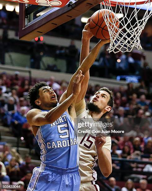 Marcus Paige of the North Carolina Tar Heels has his shot blocked by Boris Bojanovsky of the Florida State Seminoles during the game at the Donald L....