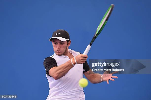 Oliver Anderson of Australia plays a forehand against Ivan Dodig of Coratia during day three of the 2016 Brisbane International at Pat Rafter Arena...