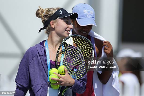Daria Gavrilova of Australia Green and Victoria Duval of the United States walk onto the practice court during day three of the 2016 Hopman Cup at...