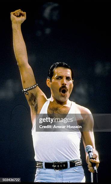 Freddie Mercury of the group Queen performs at the Live Aid concert on July 13, 1985 in London, England.