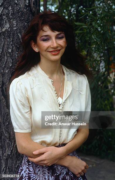 Successful female vocalist Kate Bush poses by a tree, in June 1978 in London, United Kingdom.