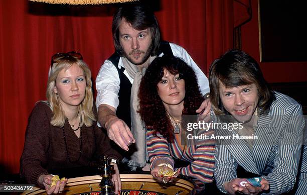 Swedish pop group Abba Agnetha Faltskog, Benny Andersson, Anni-Frid Lyngstad and Bjorn Ulvaeus, play roulette during a visit to London in 1974 in...