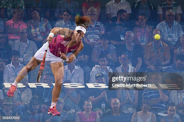 Sam Stosur of Australia serves in her match against Carla Suarez Navarro of Spain during day three of the 2016 Brisbane International at Pat Rafter...