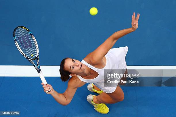 Jarmila Wolfe of Australia Gold serves to Serena Williams of the United States in her singles match during day three of the 2016 Hopman Cup at Perth...