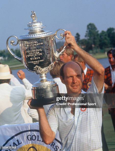 Larry Nelson of the United States holding up the trophy after winning the US PGA Championship held at the PGA National Golf Club in Palm Beach...