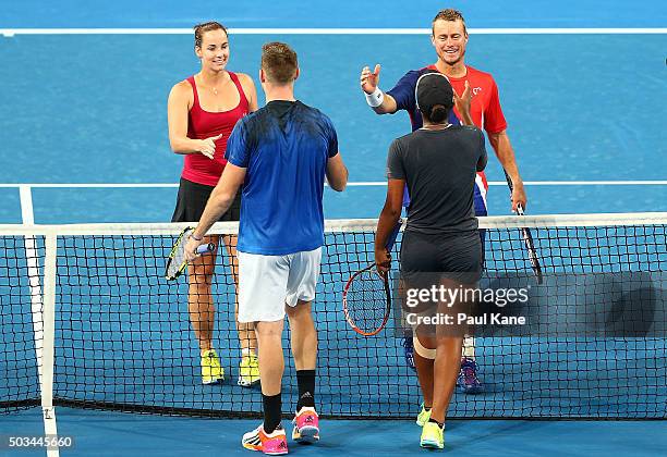 Jarmila Wolfe and Lleyton Hewitt of Australia Gold shake hands with Jack Sock and Victoria Duval of the United States after winning the mixed doubles...