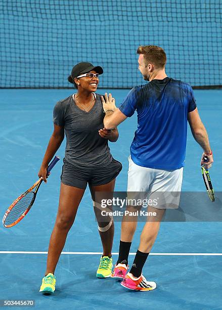 Victoria Duval and Jack Sock of the United States share a moment in the mixed doubles match against Jarmila Wolfe and Lleyton Hewitt of Australia...