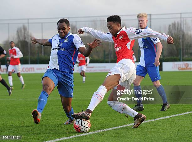 Chris Willock of Arsenal is challenged by Ryan Nyambe of Blackburn during the Barclays Premier U21 match between Arsenal U21 and West Bromwich Albion...