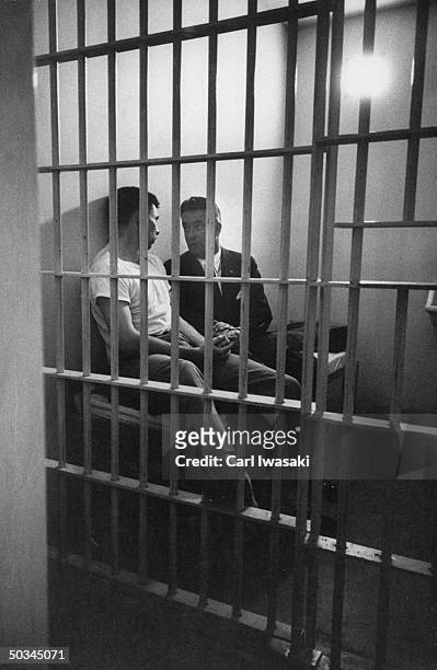 Jack Graham in the prison cell with his lawyer, John Gibbons, planning his appearance on the stand in regards to the murder of his mother & 44 others...