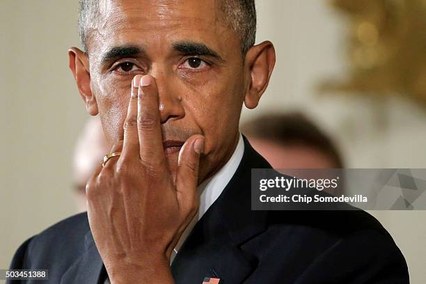With tears running down his cheeks, U.S. President Barack Obama talks about the victims of the 2012 Sandy Hook Elementary School shooting and about...
