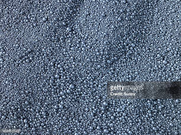 spherical granules in landscape view - granulat stock-fotos und bilder