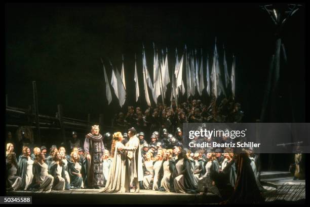 Tenor Placido Domingo w. Soprano Eva Marton as Elizabeth, singing the title role in Wagner's Lohengrin, w. The chorus on stage at the Metropolitan...