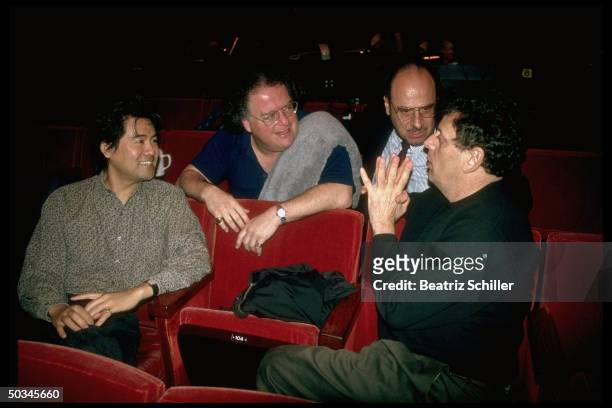 Unident. Man, conductor James Levine, Gen. Mgr. Joseph Volpe & composer Philip Glass conferring during rehearsal of his opera The Voyage at the...