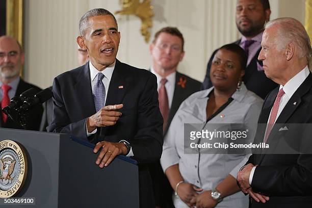 President Barack Obama delivers remarks about his efforts to increase federal gun control with Vice President Joe Biden and others in the East Room...