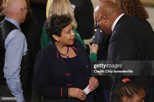 Attorney General Loretta Lynch talks with victims of gun violence, their families and supporters after before President Barack Obama delivers remarks...