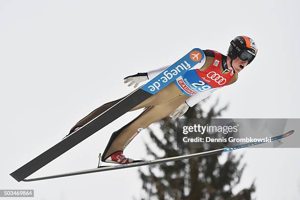 Jan Matura of Czech Republic soars through the air during his trial jump on Day 1 of the Bischofshofen 64th Four Hills Tournament ski jumping event...