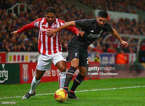 Glen Johnson of Stoke City and and Emre Can of Liverpool battle for the ball during the Capital One Cup semi final, first leg match between Stoke...