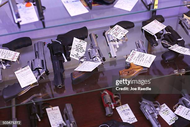 Handguns are seen on display at the K&W Gunworks store on the day that U.S. President Barack Obama in Washington, DC announced his executive action...