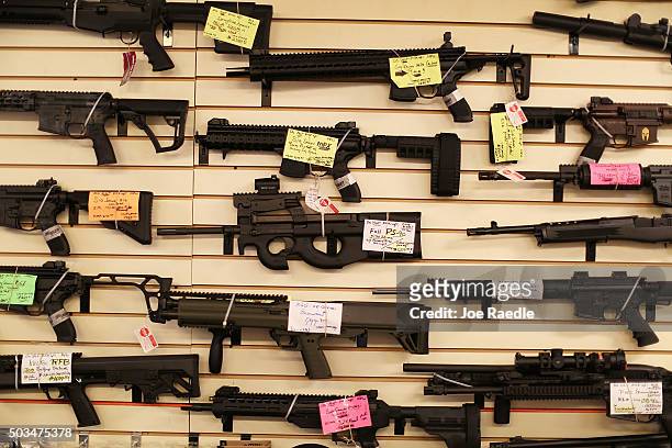 Weapons are seen on display at the K&W Gunworks store on the day that U.S. President Barack Obama in Washington, DC announced his executive action on...