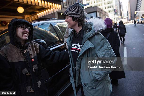 Supporters wait in line outside to listen to Democratic presidential candidate Sen. Bernie Sanders outline his plan to reform the U.S. Financial...