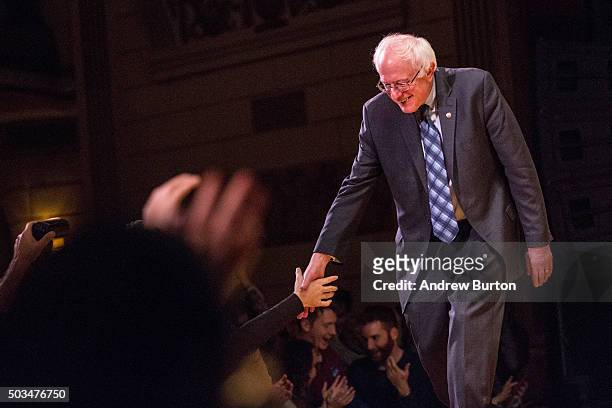 Democratic presidential candidate Sen. Bernie Sanders shakes hands with supporters after outlining his plan to reform the U.S. Financial sector on...