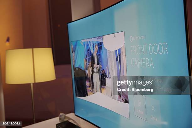 Samsung Electronics Co. Ultra Slim SUHD Quantum dot display television, with SmartCam HD Pro front door camera enabled, is displayed during an event...