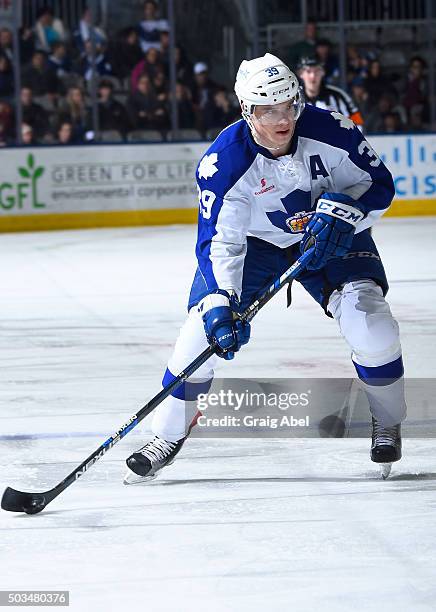 Matt Frattin of the Toronto Marlies carries the puck up ice against the Lake Erie Monsters during AHL game action December 31, 2015 at Ricoh Coliseum...