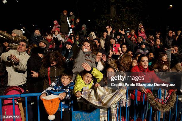 Children react as performers throw sweets to them during the 'Cabalgata de Reyes,' or the Three Kings parade on January 5, 2016 in Madrid, Spain. The...