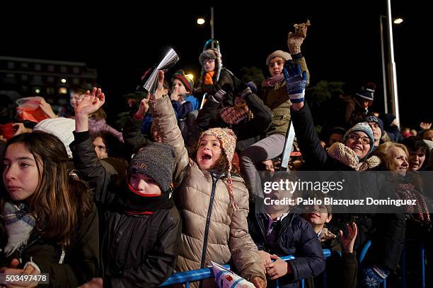 Children react as they see performers during the 'Cabalgata de Reyes,' or the Three Kings parade on January 5, 2016 in Madrid, Spain. The traditional...