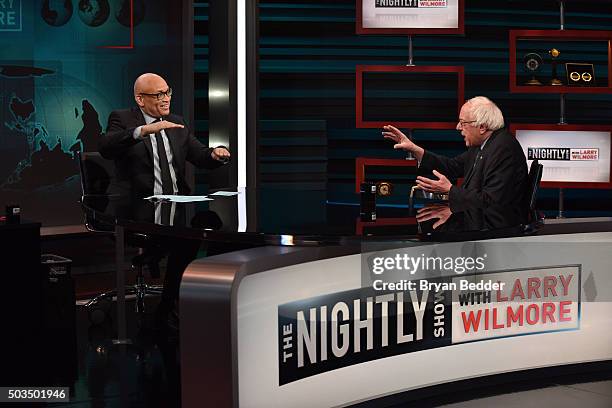 Host Larry Wilmore speaks with Senator Bernie Sanders on Comedy Central's "The Nightly Show With Larry Wilmore" on January 5, 2016 in New York City.